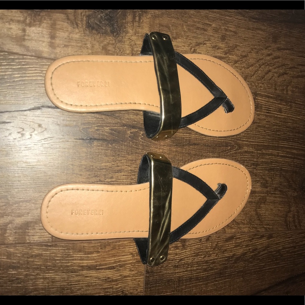 Gold and black strapped sandals